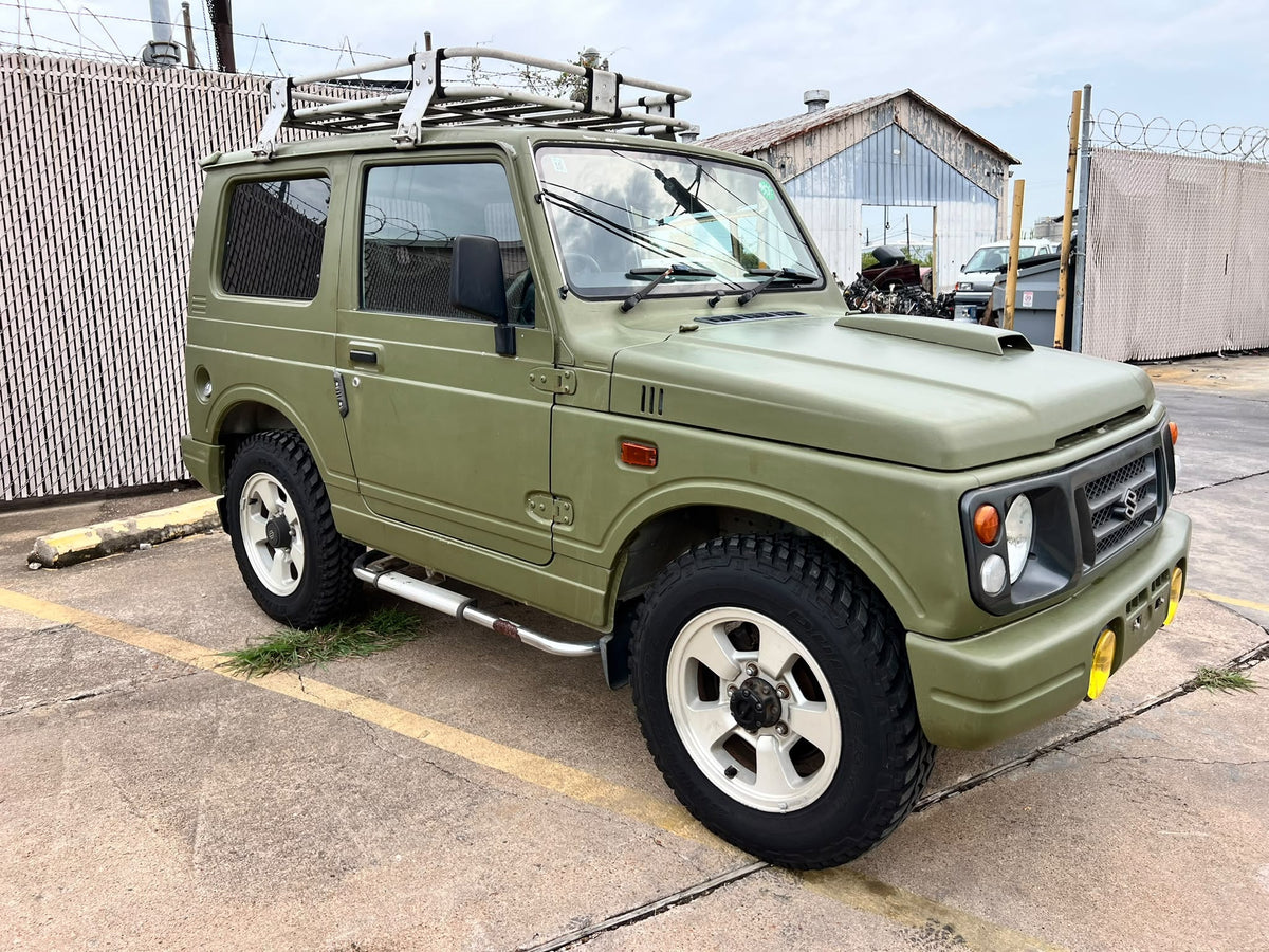 Green 1997 Suzuki Jimny 4x4 kei SUV