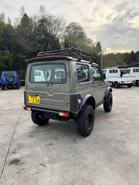 Green 1997 Suzuki Jimny 4x4 kei SUV, photo 1 of 17