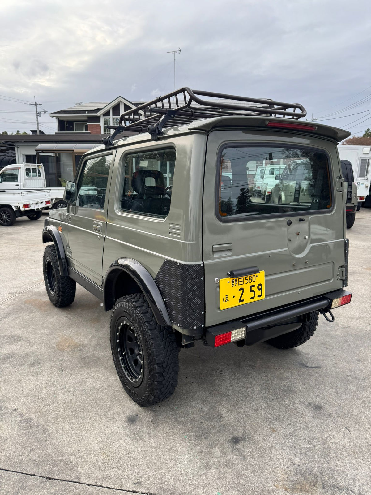 Green 1997 Suzuki Jimny 4x4 kei SUV, photo 2 of 17