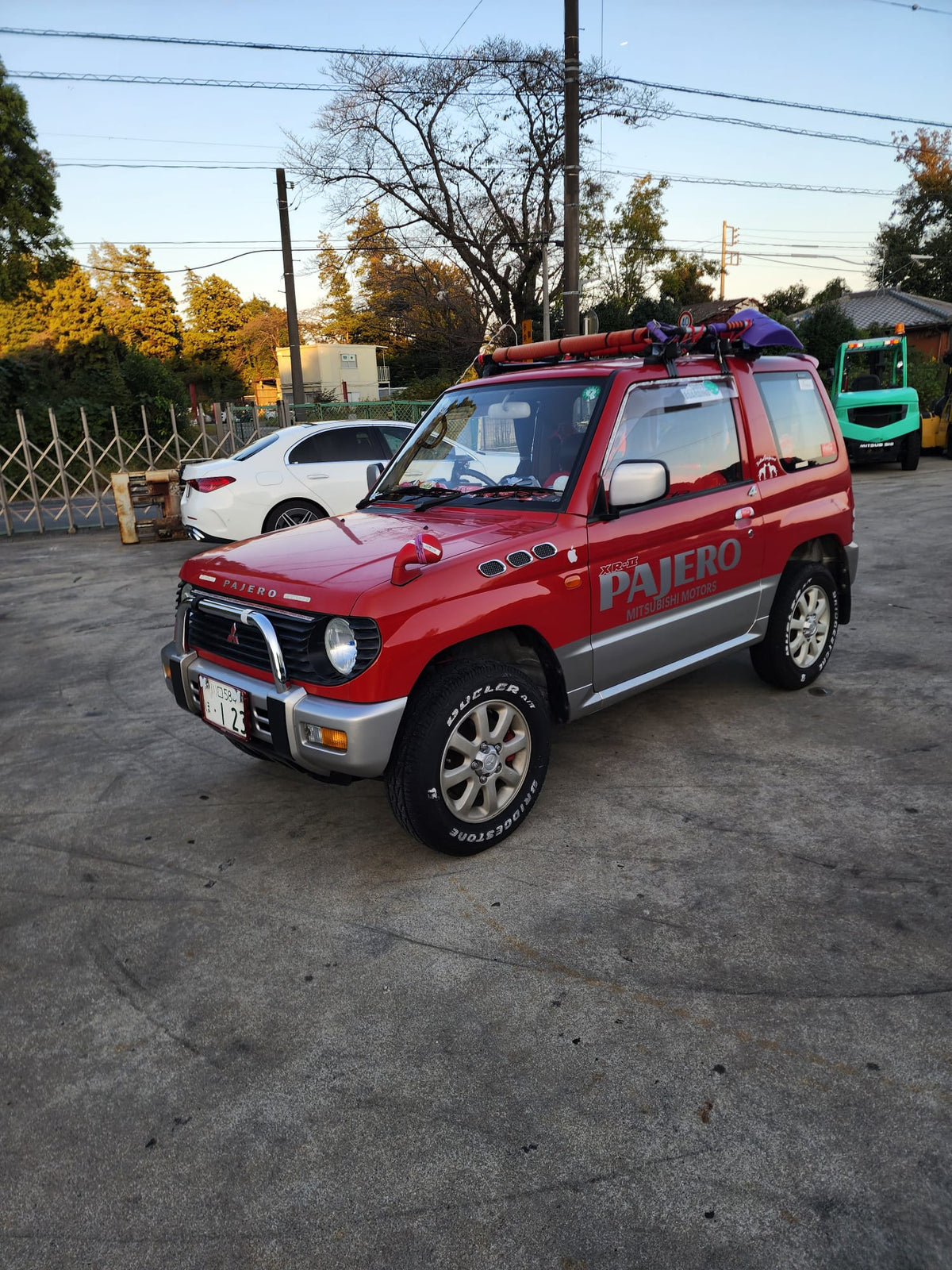 Black and red 1995 Mitsubishi Pajero SUV