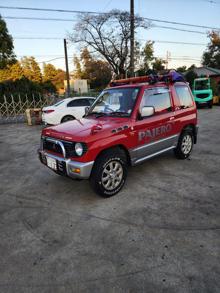 Black and red 1995 Mitsubishi Pajero SUV