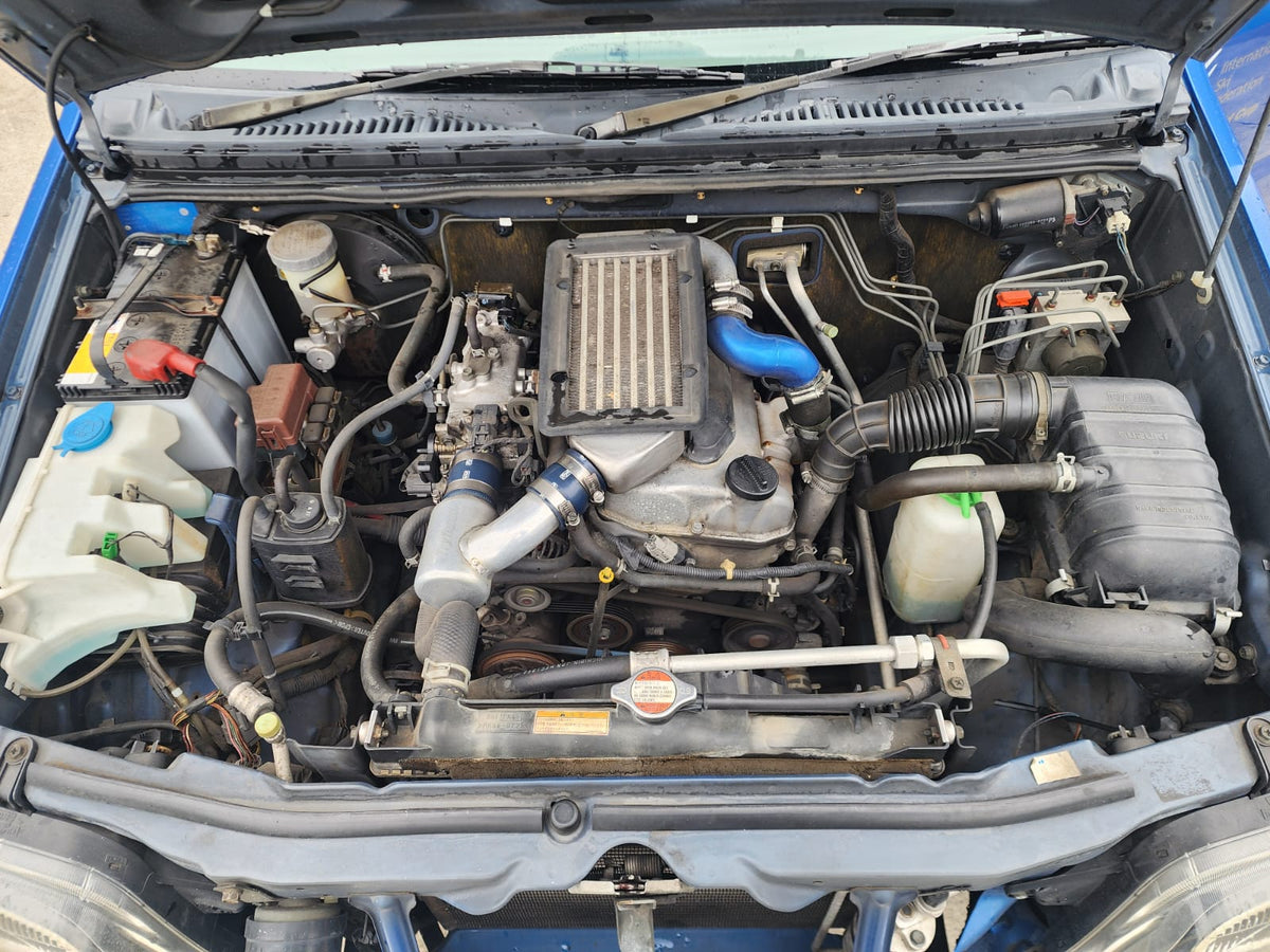 Blue/Silver 2001 Suzuki Jimny 4x4 kei SUV, photo 6 of 11