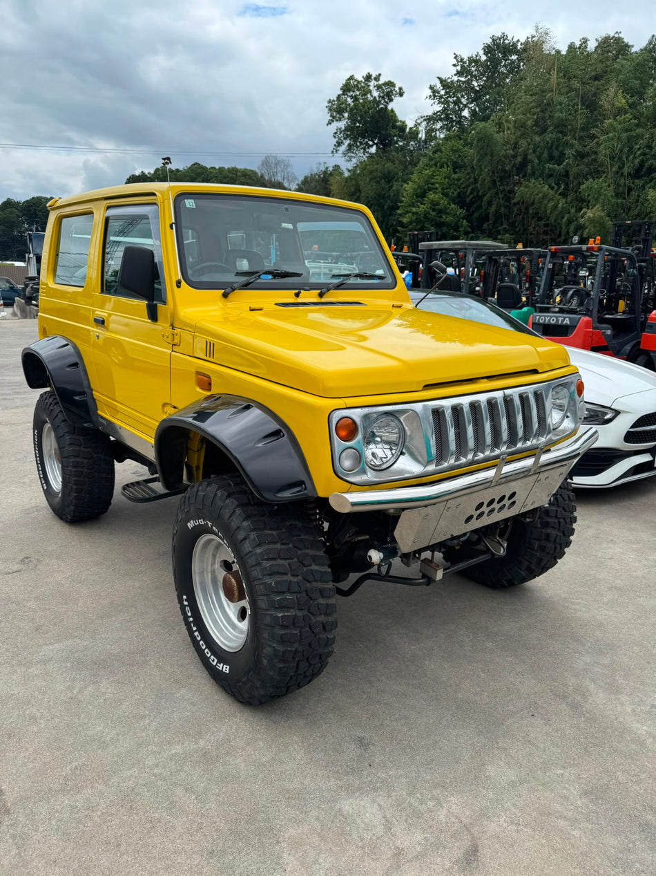 Yellow 1997 Suzuki Jimny Sierra 4x4 kei SUV