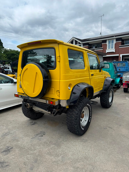Yellow 1997 Suzuki Jimny Sierra 4x4 kei SUV, photo 4 of 14