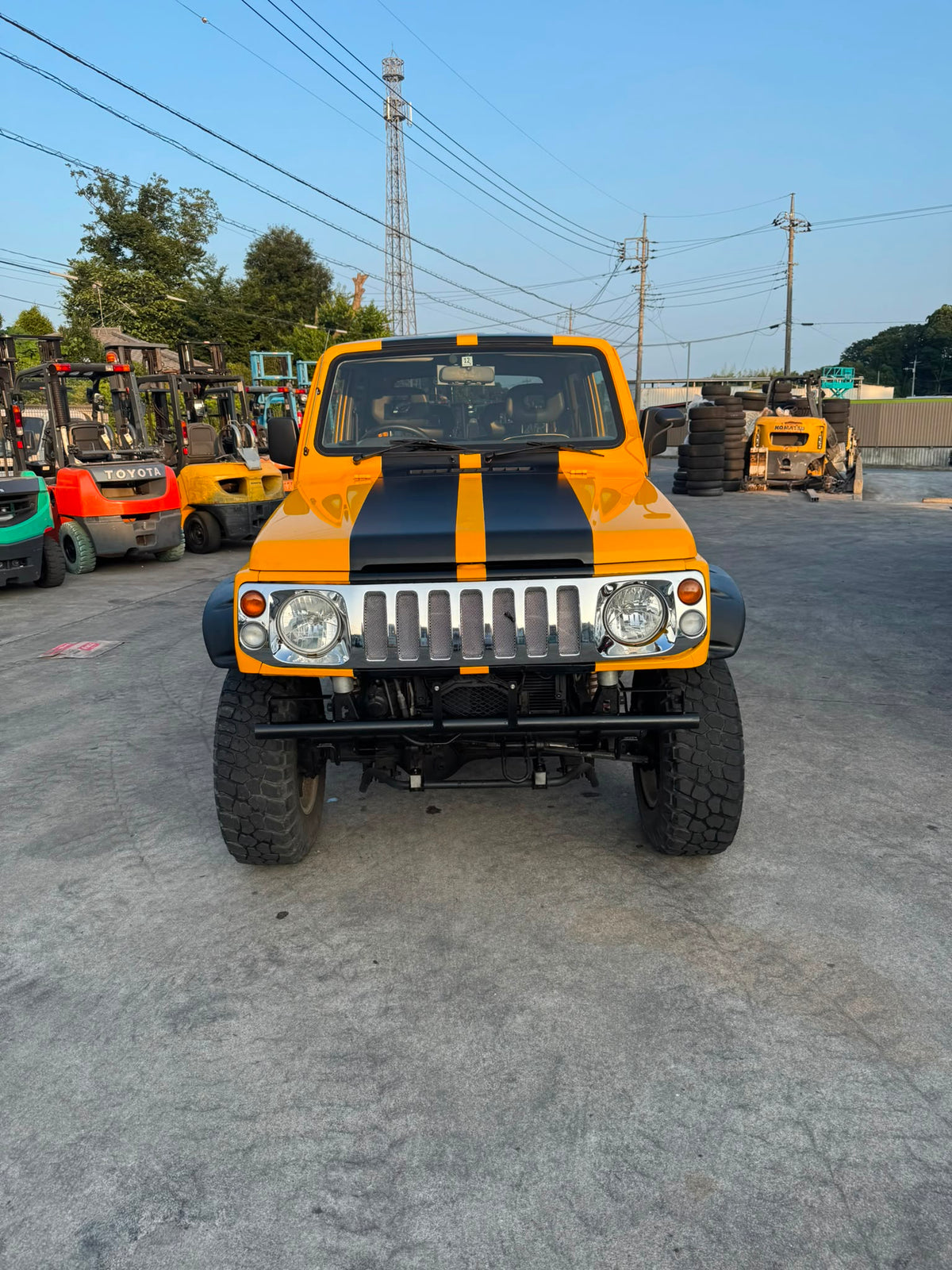 Yellow and black 1997 Suzuki Jimny Sierra 4x4 kei SUV, photo 2 of 11
