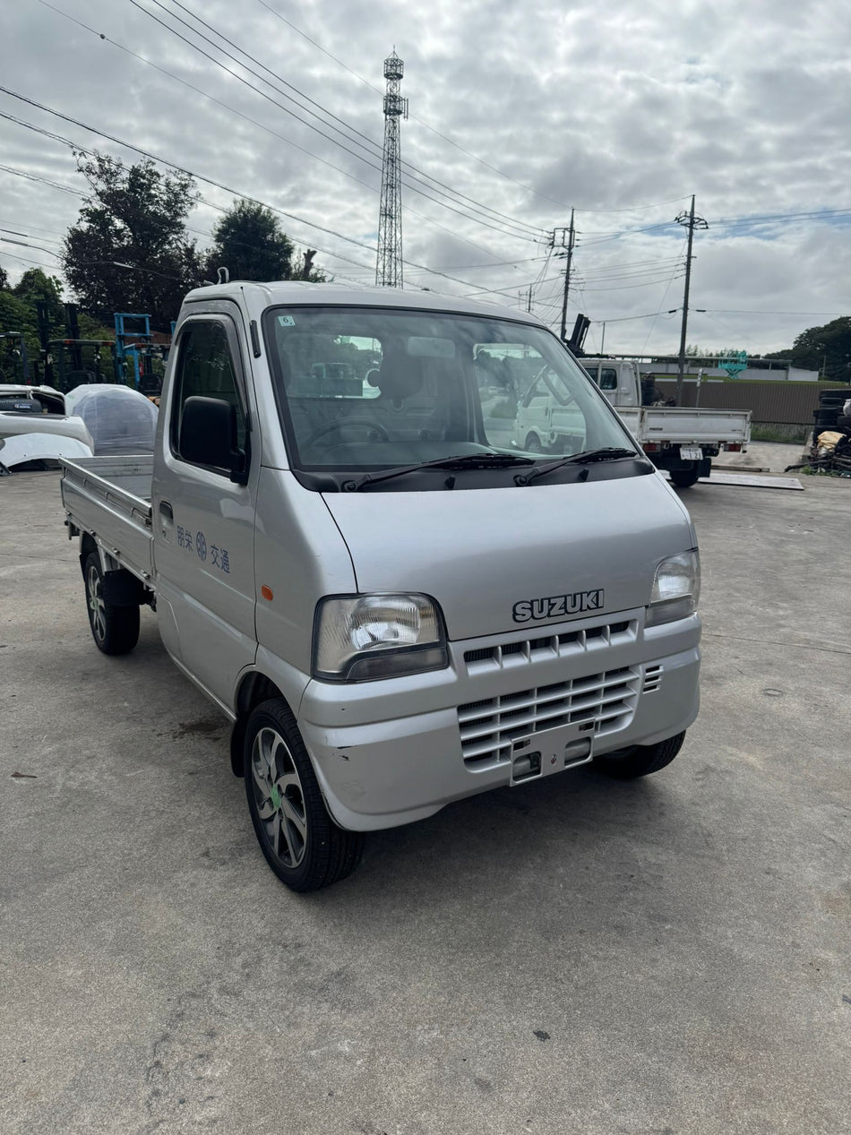 Silver 2001 Suzuki Carry 4x4 kei truck