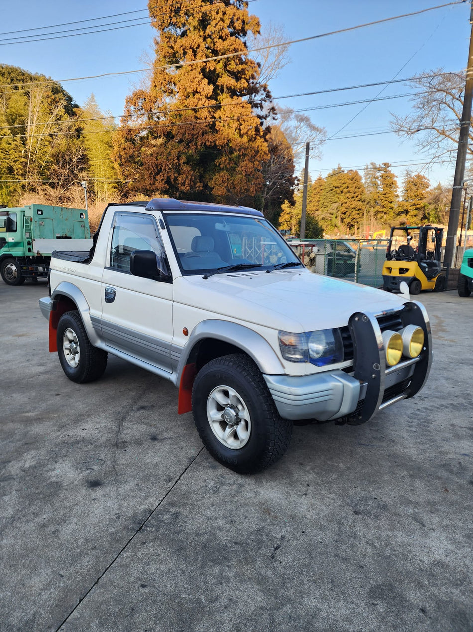 White and silver 1996 Mitsubishi Pajero Canvas Top 4WD SUV, photo 1 of 24